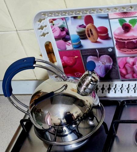 a tea pot sitting on top of a stove at B&B da Giovy in Marsala