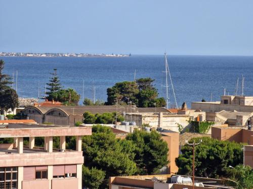 a city with the ocean in the background at B&B da Giovy in Marsala