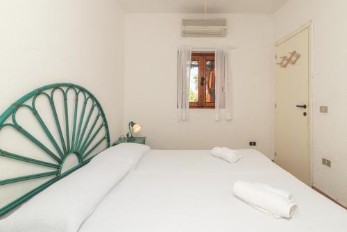 A bed or beds in a room at Villa Ari