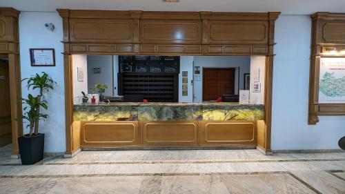 a restaurant with a counter in a building at Hotel Santa Cecilia in Ciudad Real