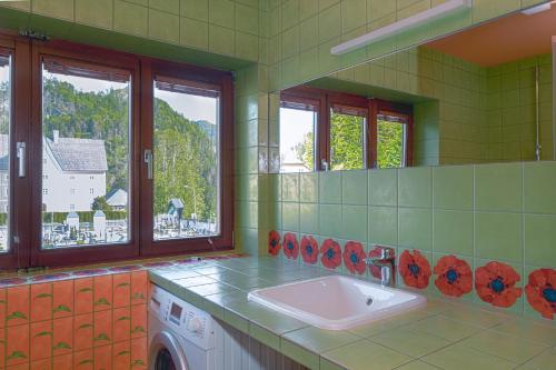a bathroom with a sink and a mirror at NaturparkResort Hobel`s Home in Wildalpen