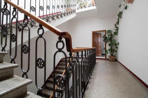 a staircase in a house with a stair railing at B&B Le Mura in Grosseto