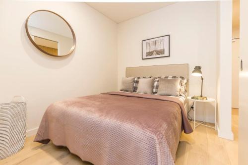 a bedroom with a large bed with a large mirror at Air Conditioned One Bedroom with Pool Close To CBD in Sydney