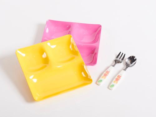 a yellow plastic box with a fork and a knife at Vessel Hotel Kanda Kitakyushu Airport in Kanda