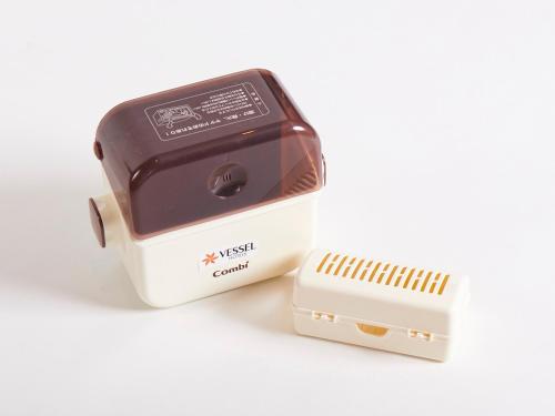 a toaster and a modem sitting next to each other at Vessel Hotel Kanda Kitakyushu Airport in Kanda