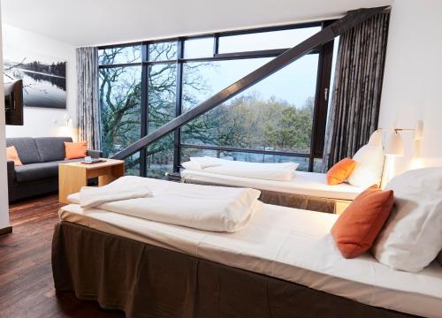 Postel nebo postele na pokoji v ubytování Vingsted Hotel & Konferencecenter