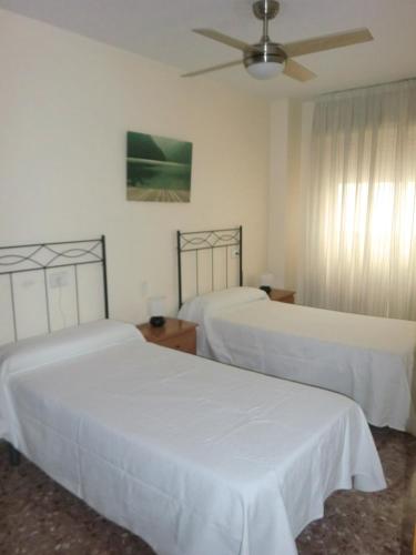 Un pat sau paturi într-o cameră la Piso La Pista Alcora