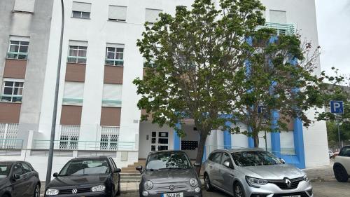a group of cars parked in front of a building at Ranjeet felizarda in Lisbon