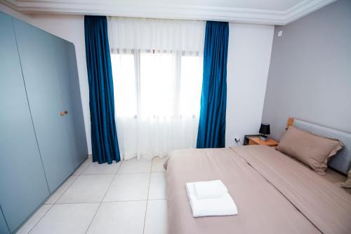 Appartement 3 chambres Spacieux et Lumineuxにあるベッド
