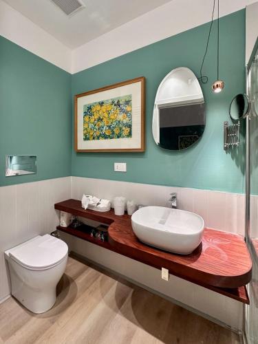 a bathroom with a sink and a toilet at La Nica in Palermo