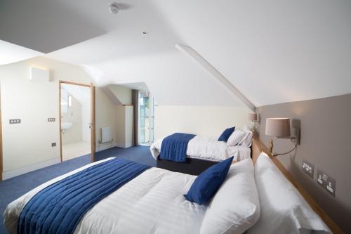 A bed or beds in a room at Northgate House 