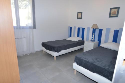 Postel nebo postele na pokoji v ubytování Corsicadream Barbicaja, superbe appartement dans villa, vue panoramique mer, piscine, proche Porticcio