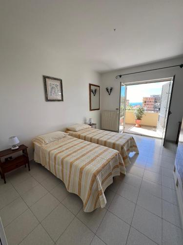 Postel nebo postele na pokoji v ubytování Casa Ermelinda