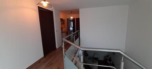 a staircase in a room with a door and a light at Cap Saint Martin Marina in Cap d'Agde