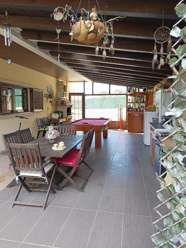 a dining room with a ping pong table in a kitchen at Casa do Castro in Bragança