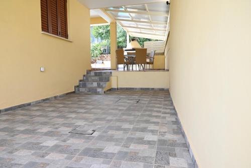 a hallway of a house with a tile floor at Kakopetria's Holiday House in Kakopetria