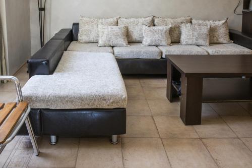 a living room with a couch and a table at Hotel Buena Vissta in Primorsko