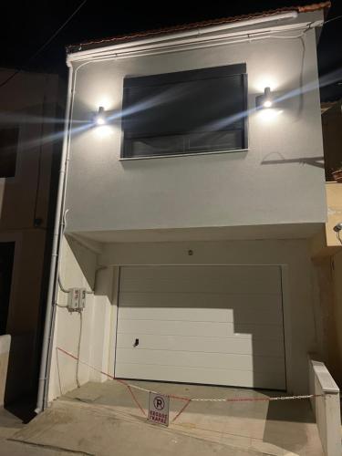 a garage door with two lights on top of it at YK_Urban_Euphoria in Chios
