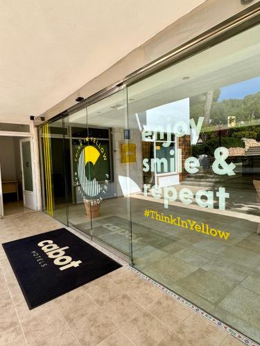a shop window with a chair in front of it at Cabot Cala Ferrera in Cala d´Or