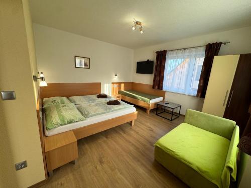 Postel nebo postele na pokoji v ubytování Apartmany Hujer