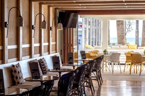 a row of tables and chairs in a restaurant at Cabot Romantic- Adults Only in Port de Pollensa