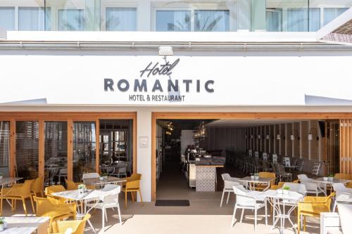 a restaurant with white tables and yellow chairs at Cabot Romantic- Adults Only in Port de Pollensa