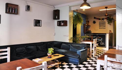 a living room with a couch and a table at Hostel Colonial in Buenos Aires