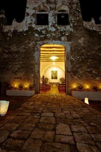 an entrance to a building with a large doorway at Hacienda Chichen Resort and Yaxkin Spa in Chichén-Itzá