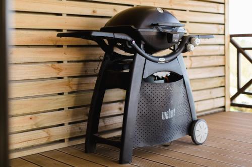a helmet sitting on top of a drone on a deck at Garden Route Ilita Lodge in Groot Brak Rivier