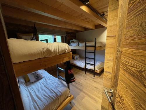 Una cama o camas en una habitación de Appartement Luxe comme un Chalet - vue exceptionnelle