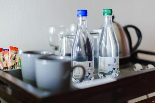 a group of bottles sitting on a counter at Garden Route Ilita Lodge in Groot Brak Rivier