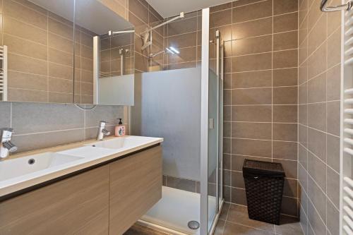 a bathroom with a sink and a shower at Villa Emilia 0206 P104 in Nieuwpoort