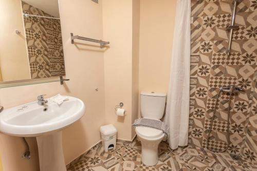 Kúpeľňa v ubytovaní Ammon Garden Hotel