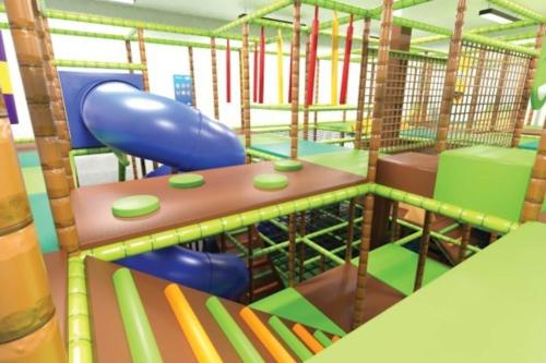 a childrens play area with a slide at Family vibes, op 5 sterren vakantiepark in Limburg in Sevenum