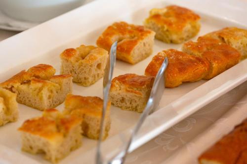 a plate of food with bread and two forks at Grand Hotel Mediterranee in Alassio