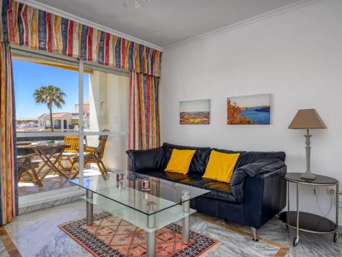 a living room with a couch and a glass table at Apartment Lorcrisur by Interhome in Marbella