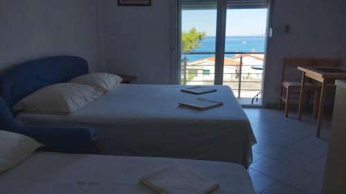 Postel nebo postele na pokoji v ubytování Apartmani Arma
