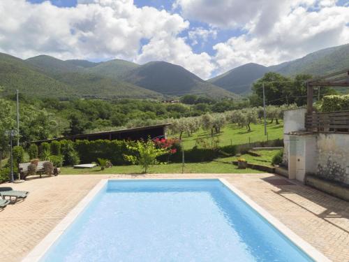a swimming pool with a view of mountains at Holiday Home Colleflaviano by Interhome in Casperia