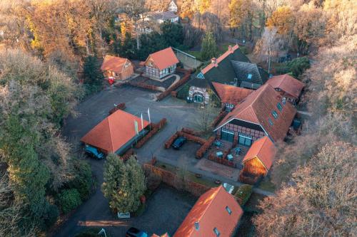 an overhead view of a large house with red roof at Ahrenshof Spieker W 11 in Bad Zwischenahn