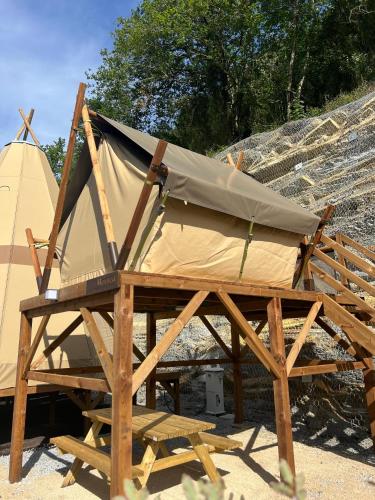 a tent and a teepee on a wooden structure at Camping Igara de San Sebastian in Donostia-San Sebastián
