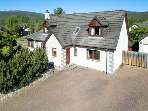 an aerial view of a house with a driveway at Villa Craigmore Lodge by Interhome in Aviemore