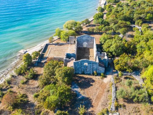 an aerial view of an old house on the shore of the ocean at Apartment Alenka by Interhome in Omišalj