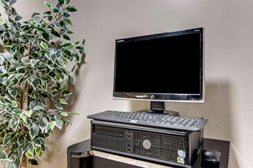 a desktop computer sitting on top of a computer tower at Sleep Inn near I-80 and I-94 in Lansing