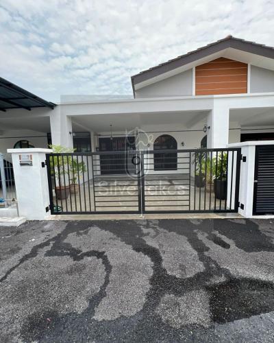 a house with a gate and a driveway at The9 Silverlakes Homestay in Batu Gajah