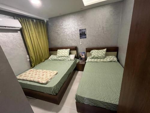 Ένα ή περισσότερα κρεβάτια σε δωμάτιο στο Marasi marina 1