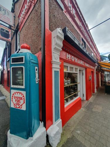 a blue mailbox sitting in front of a store at The Retreat in Carlingford