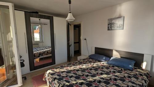 a bedroom with a bed and a large mirror at Apartment in the historical city center with amazing seaviews Peter Pan in Poreč in Poreč