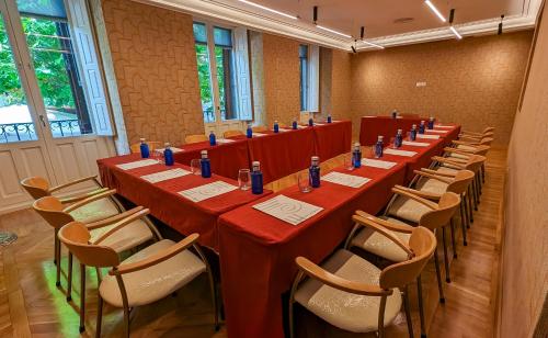 a conference room with long tables and chairs at Hotel Opera in Madrid