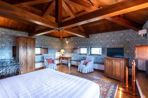 Postel nebo postele na pokoji v ubytování Relais Il Canalicchio Country Resort & SPA