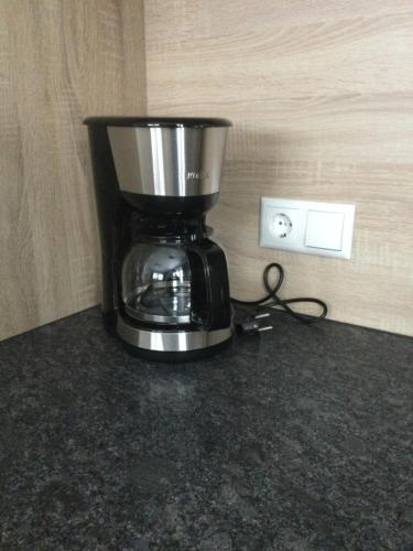 a coffee maker sitting on top of a counter at Ferienwohnungen Lederstube Seidl in Maria Alm am Steinernen Meer